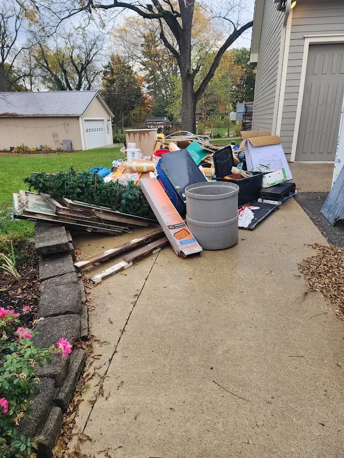 Dumpster being loaded with debris for 3 Yard Dumpster Rental in Carencro